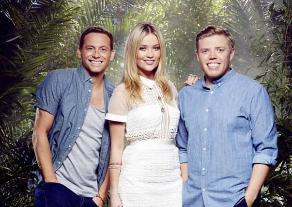 Im A Celebrity Get Me Out Of Here Now! presenters Joe Swash, Laura Whitmore and Rob Beckett