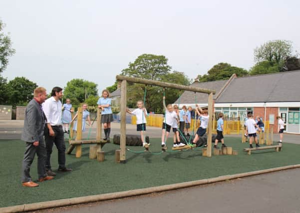 Pupils at Kirkland and Catterall St. Helens CE Primary School in the playground
