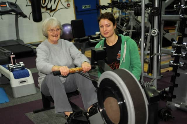 ENDURANCE TEST: Pat on the rowing machine with her personal trainer Jenny Wren