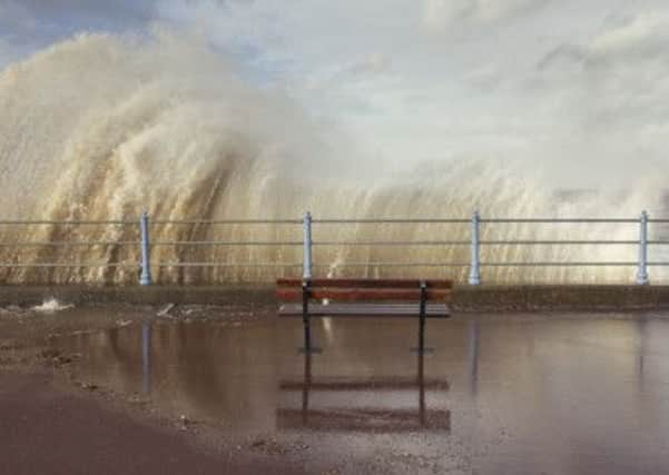 Beautiful: A dramatic photo of waves slashing the seafront from Debbie Yares book Tidelands