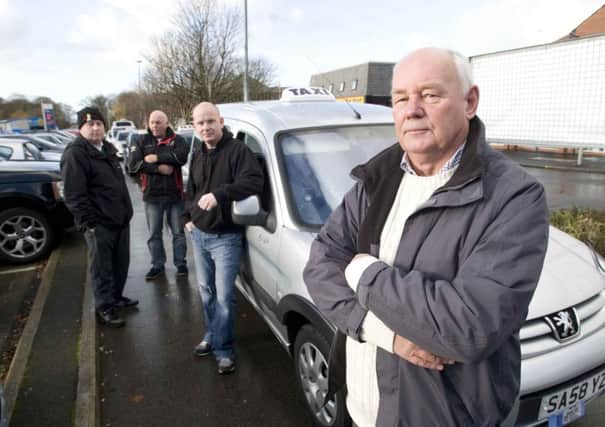 Taxi driver, Ray Bailey, right, has started a petition calling on South Ribble Council to raise taxi fares because taxi drivers are struggling, from left, taxi drivers, Gerard Burne, James Belfield and Scott Washington