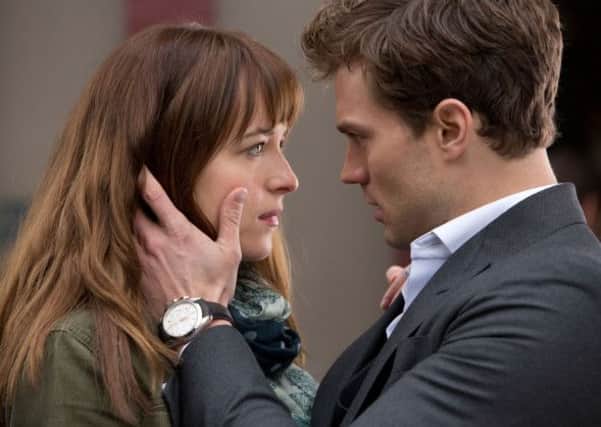 Fifty Shades of Grey: Dakota Johnson as Anastasia "Ana" Steele and Jamie Dornan as Christian Grey.