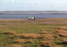 Police at the scene in Lytham after a body was found on the foreshore