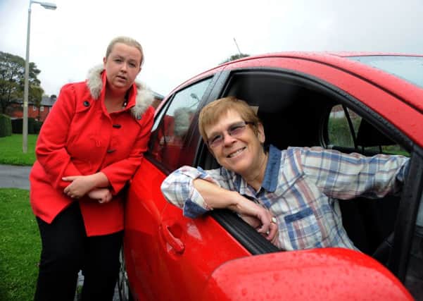 SAVED: Volunteer driver Claire Gillard and Coun Kim Snape with a community car serving rural Chorley in 2013