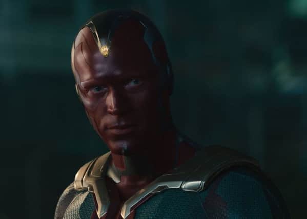 Paul Bettany as Vision in Marvels Avengers: Age Of Ultron and, inset, the real -life Paul  not the Purple Daddy  and the cast of the film