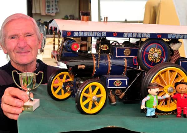 Keith MacNamara of Chorley with his model of a steam tractor which won him this trophy. Photo: David Hurst