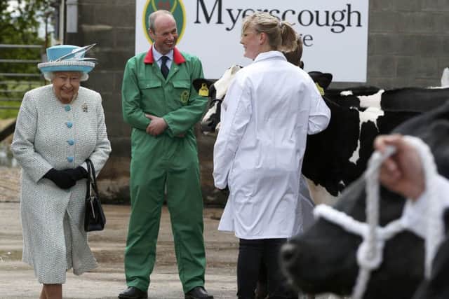 Queen Elizabeth II inspects cattle at Myerscough College during her visit to Lancaster, after she arrived at the historic city by royal train. PRESS ASSOCIATION Photo. Picture date: Friday May 29, 2015. See PA story ROYAL Lancaster. Photo credit should read: Andrew Yates/PA Wire