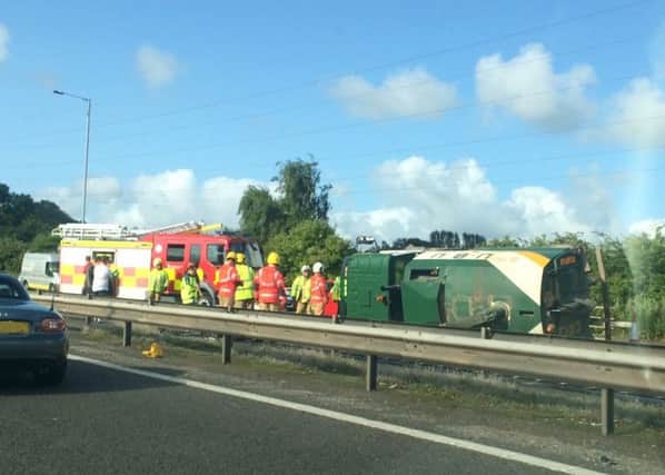 Firefighters attend to the overturned lorry on the M6. Photo taken by Paul Burgess