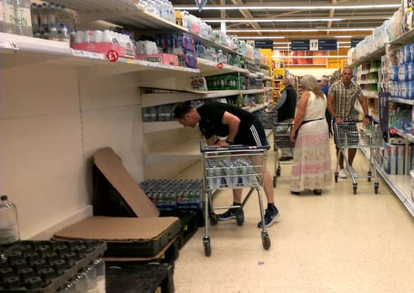 Empty shelves at Tesco in Leyland, after customers rushed to stock up on water supplies