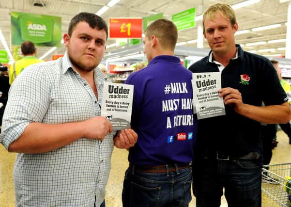 Milk Trolley Challenge by disgruntled Lancashire dairy farmers at the Asda store in Blackpool. Organisers Jack Raby, left Harry Meadows and Robert Mason.  Picture by Paul Heyes, Saturday August 08, 2015.