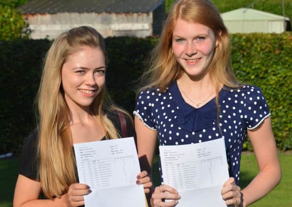 Ceri Gibbons who achieved A,A,B (left) and Miranda Wild who achieved A,B, B (right). Two of the top performing students.
