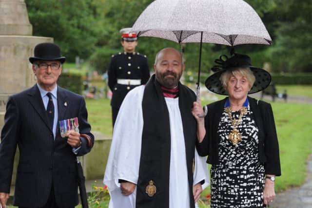 Photo Neil Cross: Father Timothy Lipscombe with the Mayor of Preston, Coun Margaret McManus at the ceremony to mark the 70th anniversary of VJ day at the war memorial in Preston Cemetry
