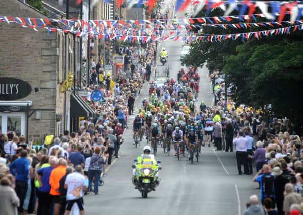 Crowds turn out to watch stage 2 of the Tour of Britain heads down Berry Lane and passes through Longridge