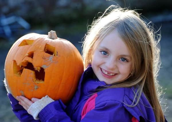 Autumn Fun Day at Worden Park, Leyland. Amelie Taylor-Bamford aged 7 from Coppull with her Pumpkin. Picture by Paul Heyes, Monday October 26, 2015.