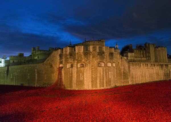 Blood Swept Lands and Seas of Red' poppy installation at the Tower of London. Photo by Sebastian Remme/REX (4240804d)