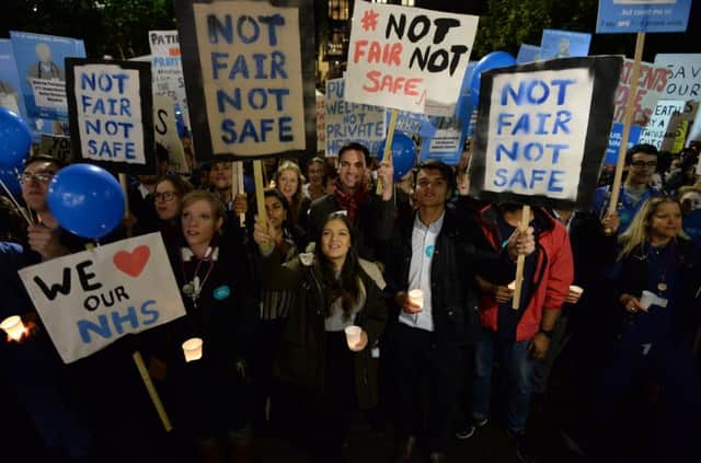 Junior doctors and medical students protest against the proposed changes to their contracts during a recent rally