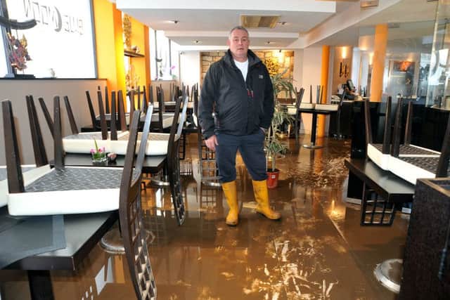 Aftermath of the unprecedented flooding over the weekend in Lancaster.
Co-owner of the Blue Moon Thai restaurant on Rosemary Lane Dave Furey stands amidst the wreckage.