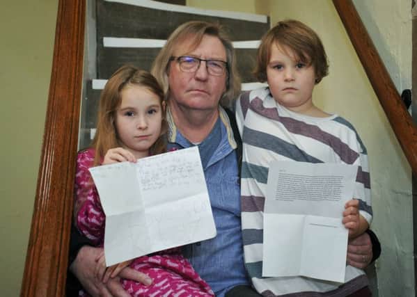 APPEAL: Kate Wall and her brother Louis Wall, who have written appeal letters to save the Museum of Lancashire, from closure. Pictured with grandad Kenneth Cook