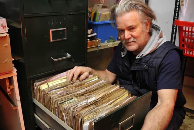Graham Landon from Poppies of Whalley with ruined files in the stockroom.  Pic: Rob Lock.