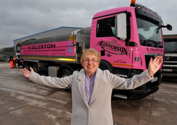 Rose, wife of the late John Robinson, with the new pink wagon