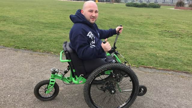 On the move: Rick Clement with his new wheelchair