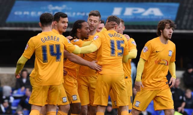 Preston North End's Daniel Johnson (3rd left) is mobbed by his team mates after scoring the opening goal of the game