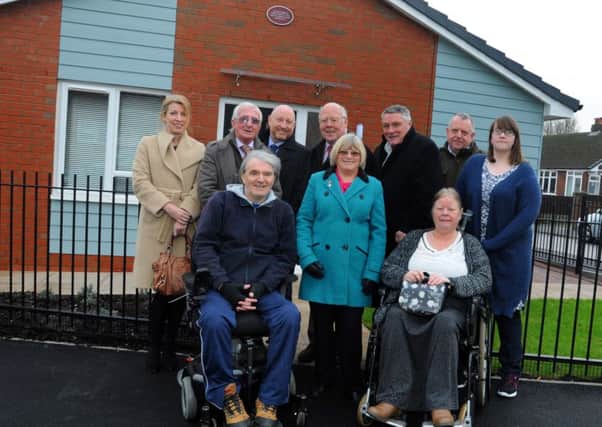 Councillors and tenants join Adactus' chief executive Paul Lees, back row third from right, at the property on Thirlmere Road, Chorley