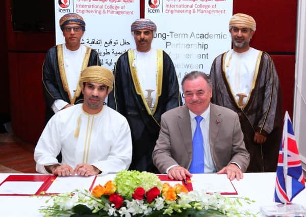 Mr Affan K. Al Akhzam, Chief Executive Officer at ICEM signs the new contact with UCLan Pro Chancellor and Chair of the University Board David Taylor.