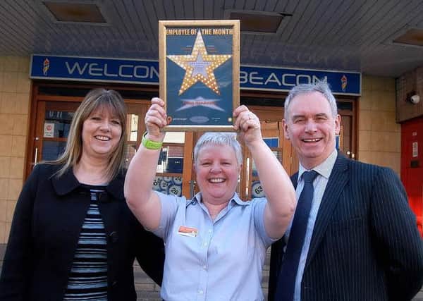 Employee of the Month Tracy Sanderson centre with Jenny Mclaren head of HR and Nick Harding CEO of Praesepe.