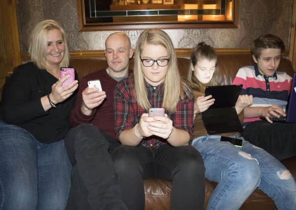 GADGETS: Justine and Chris Forrest with their children Alex, Millie and Chris
