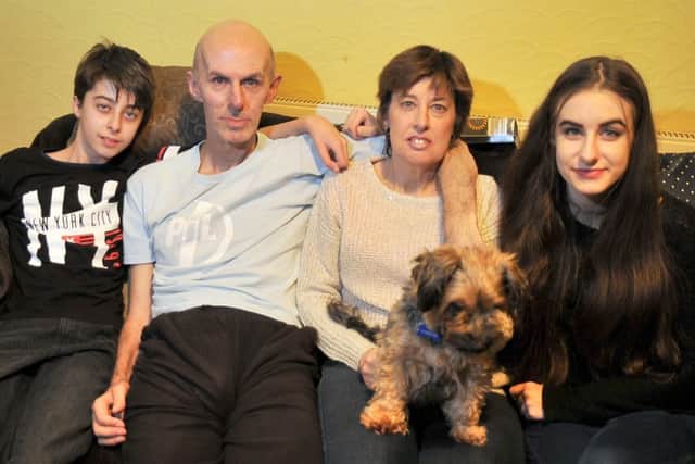 The Bogumil family, from left, Aaron, Chris, Susan and Amber with 'Pip'