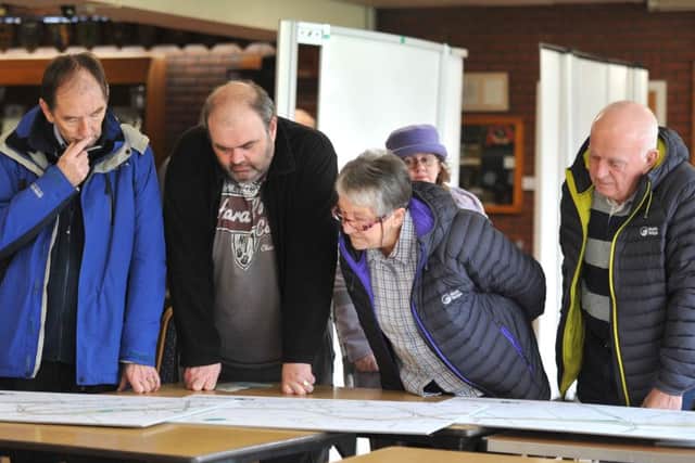 Where? Members of the public scrutinise plans for the new road at  one of the recent information events