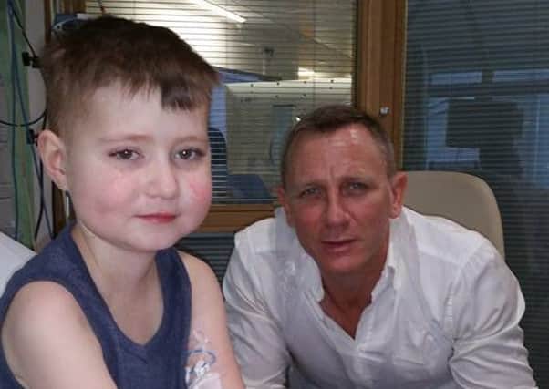 Jack Johnstone, nine, of Hoghton, near Preston with James Bond star Daniel Craig at London's Great Ormond Street Hospital.