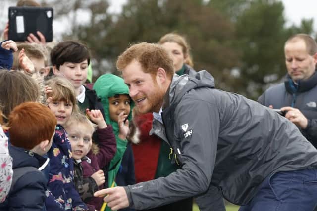 Prince Harry meets children from Weeton Primary School and Honeypots Nursery during a visit to Weeton Barracks near Blackpool. PRESS ASSOCIATION Photo. Picture date: Friday February 5, 2016. Harry also met some of the soldiers from the 2nd Battalion, The Duke of Lancaster's Regiment, who were deployed to Lancashire, Yorkshire and Cumbria to find out how they aided recovery work in the recent floods. See PA story ROYAL Harry. Photo credit should read: Owen Humphreys/PA Wire