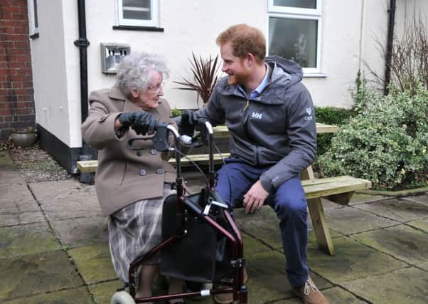 PHOTO NEIL CROSSPrince Harry in St Michaels during a visit to meet local flood victims, with 97 year old Winifred Hodson