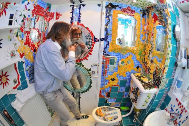 Photo Neil Cross
Jam Imani Rad has spent years turning his council flat into a wacky den of his art