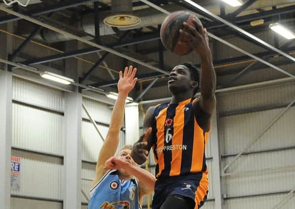 Moses Byekwaso drives past a Manchester Magic defender (photo: Mansoor Ahmed)
