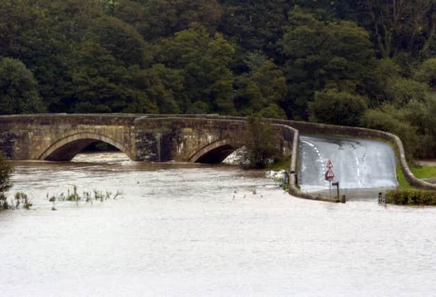 Floodwaters around the Loyne Bridge at Gressingham which resulted in the closing of the bridge and road btween Hornby and Gressingham.