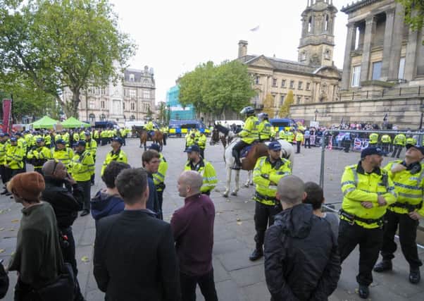Two rival groups gather to protest in Preston city centre about immigration