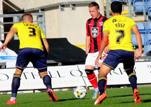 Shaun Beeley, in action against Oxford earlier in the season, is a doubt with thigh problem.