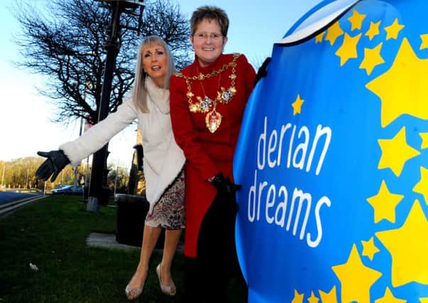 CHORLEY GUARDIAN  15-02-16
The Mayor of Chorley Councillor Marion Lowe, right, shows her support for the Derian Dreams campaign, the big blue circles which have appeared around the borough, this one across from Chorley Town Hall for Derian House Children's Charity, pictured with Susie Poppitt, left, head of fundraising for the charity.