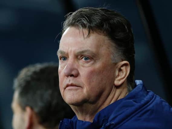 HANGING ON: Louis van Gaal