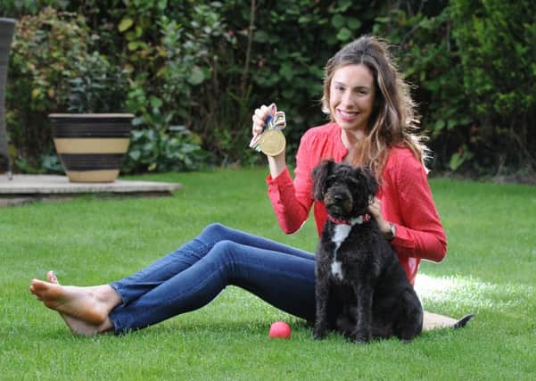 Photo Neil Cross
Pentathlon her World Champion Samantha Murray with her gold medal and her jackadoodle, Bobby