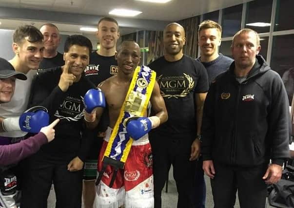 Michael Ramabeletsa claimed the British Challenge Super Bantamweight crown. He is pictured with his team, including trainer Johnney Roye (third from right)