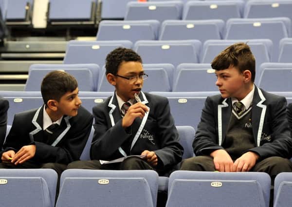 HEADS TOGETHER: Above, Fulwood Academy pupils taking part in a Guinness World Record attempt for the most people participating in a simultaneous book quiz