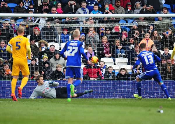 Anthony Pilkington beats North End goalkeeper Anders Lindegaard from the penalty spot in the first half