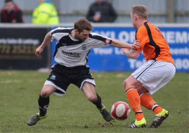 Alistair Waddecar in action against Mossley. Photo credit: Paul Vause.