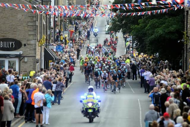 Crowds turn out to watch stage 2 of the Tour of Britain heads down Berry Lane and passes through Longridge