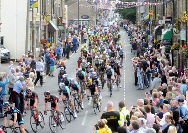 Crowds turn out to watch stage 2 of the Tour of Britain heads down Berry Lane and passes through Longridge