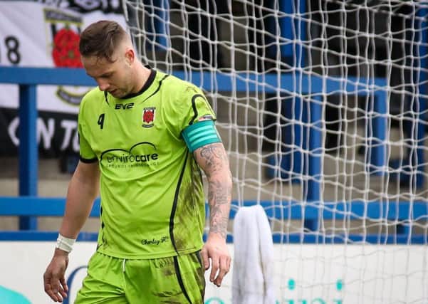 Skipper Andy Teague walks back to the dressing room after receiving a red card against Telford. Photo Josh Vosper.